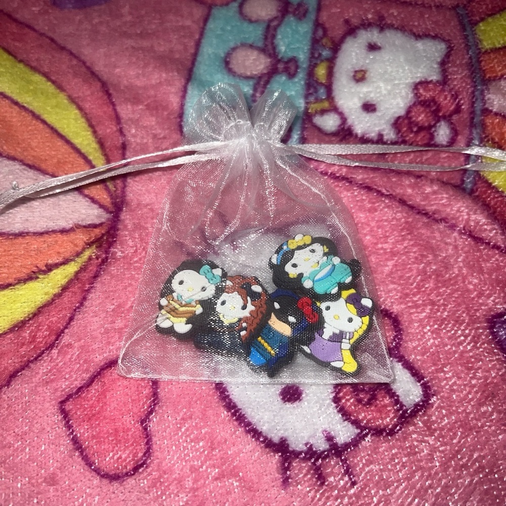 Hello kitty crocs charms 5 for 10 dollars
